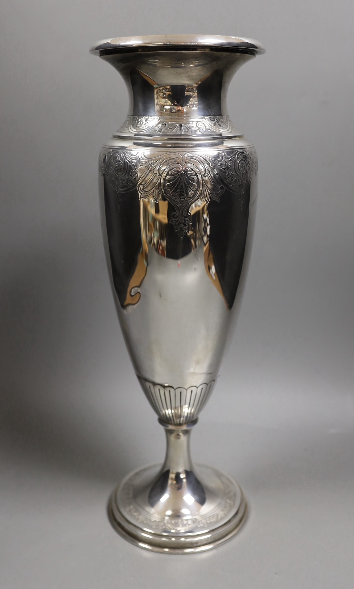 A North American sterling tall vase, with engraved decoration, 40.6cm, weighted.